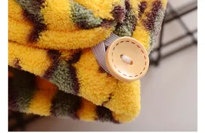 Coral fleece leopard print hair drying towel cap detail with wooden button and elastic band.