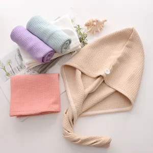 Gorro de secado de pelo de nido de abeja y toalla absorbente suave y cómoda.