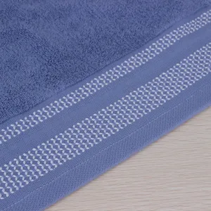 Toalla facial dobby de puro algodón suave absorbente azul vista principal para uso diario hogar