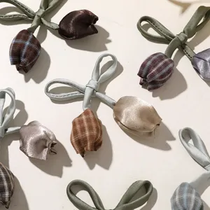 Sweet plaid satin tulip bows DIY hair accessories and clothing material details display.