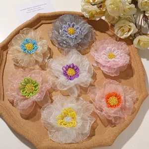 Close-up detail of handmade organza beaded flower appliqués, vibrant colors for DIY crafts.