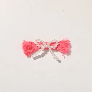 Pink pearl bow DIY hair accessory, fabric tassel craft shoe clip and bag charm trim.