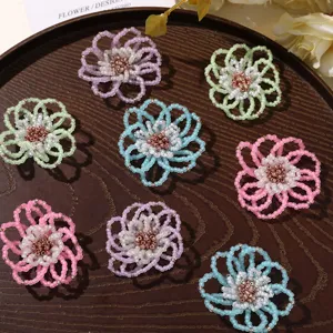 Close-up detail of colorful frosted beaded hollow flowers, perfect for DIY jewelry and crafts.