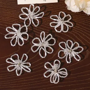 White beaded flower DIY accessories for earrings brooches hair clips handmade crafts.
