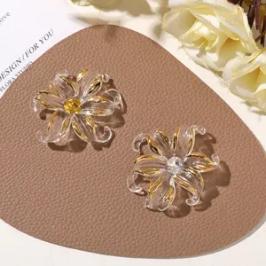 Accessoires DIY de fleurs roulées dorées en résine transparente avec des strass pour épingle.