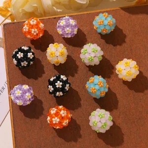 Detailed view of colorful beaded daisy flower balls, perfect for DIY handmade jewelry and hair accessories.