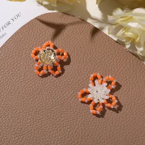 Handmade orange bead flower DIY charms, cute small jewelry accessories for earrings and rings.