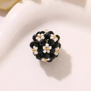 Handmade black and white beaded flower ball detail shot, perfect for DIY earrings and hair.
