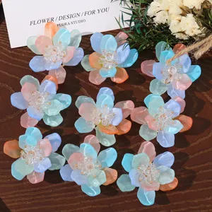 Colorful translucent resin flower DIY accessories with bead centers for earrings and shoes.