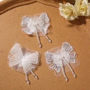 White beaded sequin chiffon butterfly patch with crystal tassel DIY craft sewing accessory.