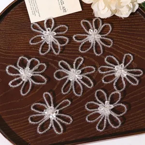 Handcrafted white beaded flower DIY accessories for earrings, brooches, and hair clips.