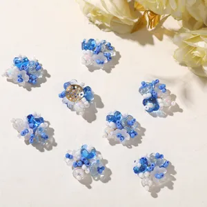 Close up of sea salt blue and white beaded flower DIY components, showing intricate details.