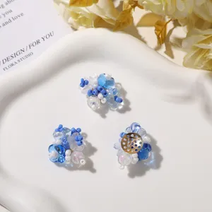 Detailed view of handmade blue and white beaded flower DIY accessories for crafts and jewelry.