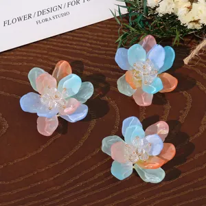 Detailed close-up of translucent pastel resin floral DIY jewelry accessories with crystal.