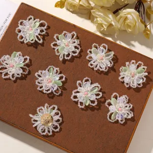Detailed view of DIY beaded flower charms, translucent beads and green resin petals for accessories.