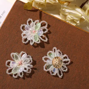 Close-up detail of summer fresh beaded hollow flower DIY accessories for shoes, brooches.
