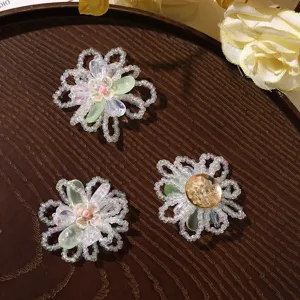 Close-up detail of summer fresh handmade glass beaded hollow flower DIY accessories.