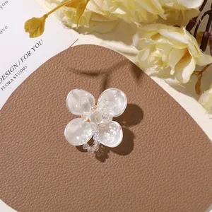 Pearl crystal flower patch DIY accessory detail shot for earrings hair pins and clothing decoration.