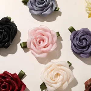 Colorful satin ribbon rose flower accessories for DIY hair clips, brooches, and clothing decor.