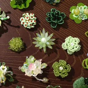 Green beaded flower DIY charms accessories for handmade earrings hair clips and clogs shoes.