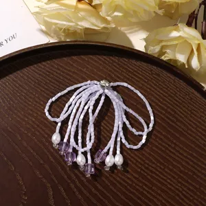 Handmade beaded tassel hair accessory with crystal rhinestones, elegant DIY fashion jewelry piece.