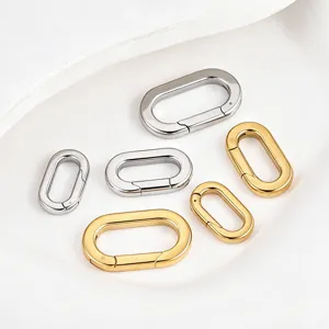 Close-up of polished oval spring clasps, stainless steel DIY jewelry connection parts.