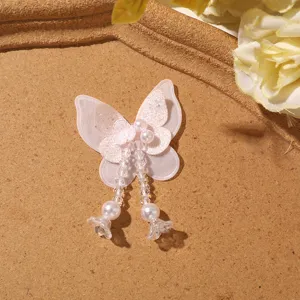 Pink mesh butterfly patch with beaded tassels, perfect for fairy DIY hair accessory details.