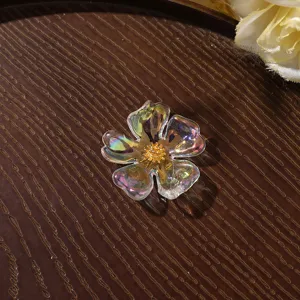 Clear iridescent acrylic flower detail shot, golden pistil, perfect for DIY jewelry crafting.