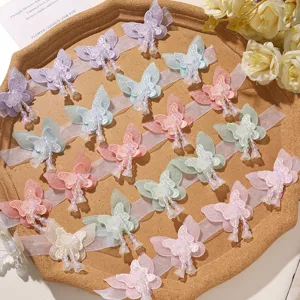 Close-up detail of fairy style mesh beaded double layer butterfly patch DIY hair accessory.
