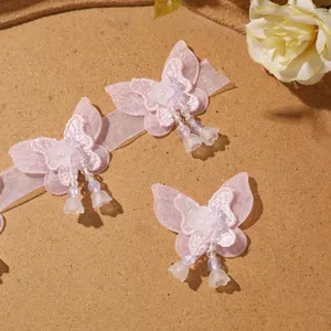 Pink mesh butterfly patch with beaded tassels, perfect for DIY hair accessories and clothing.