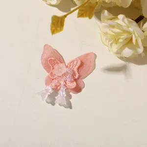 Pink mesh embroidered butterfly patch with beaded tassel for DIY hair accessories and apparel.