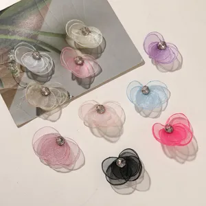 Colorful mesh flower DIY accessories with sparkling rhinestones for hair clips, earrings, and apparel.