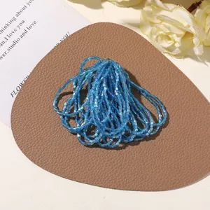 Blue bugle glass beads for DIY jewelry making, handmade crafts and accessories detail.