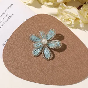 Handcrafted beaded flower accessory in summer blue, perfect for DIY jewelry, brooches, or shoes.