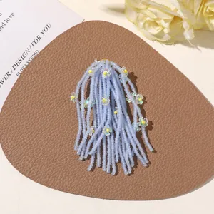 Handmade blue beaded tassel flower hair accessory, perfect for summer vacation and DIY crafts.