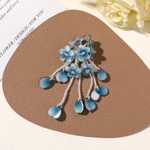 Handmade blue beaded flower DIY hair clip brooch accessory, summer vacation style.