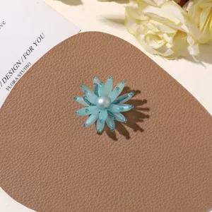 Handmade blue beaded flower detail shot, perfect for DIY jewelry making, earrings, and brooches.