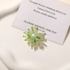 Green beaded flower charm detail close up, perfect for DIY jewelry earrings hair clips and shoes.