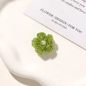 Green beaded flower DIY accessory with pearl center for shoes, hair clips, and earrings.