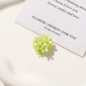 Green beaded flower DIY accessory detail view, fresh floral charm for custom jewelry and shoes.