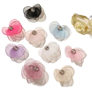 Colorful mesh flower DIY accessories with central rhinestones, perfect for hair pins.
