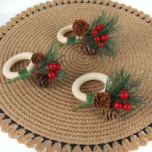 Christmas wooden napkin rings with pine cones red berries and pine needles table decor