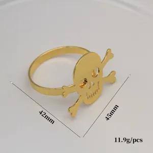 Gold skull napkin ring detail view, metal Halloween table decor 42x45mm 11.9g piece.
