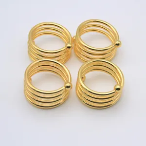 Lot de 4 ronds de serviette spirale dorés, décoration de table élégante pour mariage et hôtel.