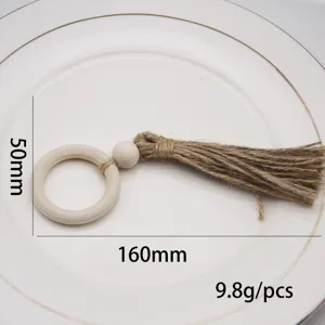 Handmade braided jute rope napkin ring with wooden beads and tassel, pastoral style for table decor.