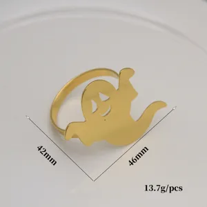 Halloween cartoon metal napkin ring table decor detail view, gold finish ghost napkin holder.