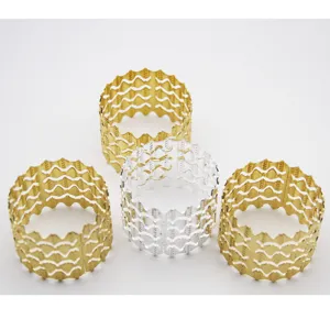 Metal napkin rings with hollow wave design, elegant table decor for hotel and home dining.