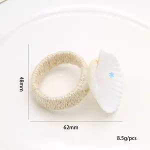 Natural white seashell napkin ring with hemp rope, elegant western restaurant table decor item.