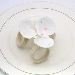 Handcrafted natural white seashell napkin ring for table decor, elegant hotel restaurant accessory.