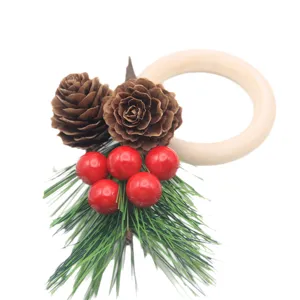 Christmas napkin ring featuring wooden ring pine cones red berries for festive decor.